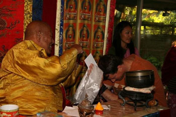 Mark Kirlin makes an offering to Lama Tsering Wandg. Taken in September, 2010 at Dorje Ling in Portland.