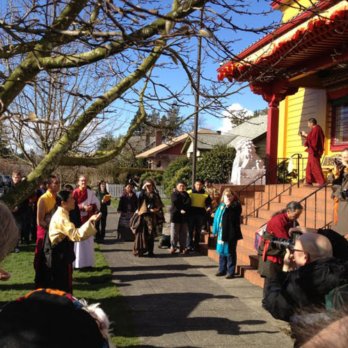 Marchers gather at Sakya Monastery and make offerings, early on Feb. 22.