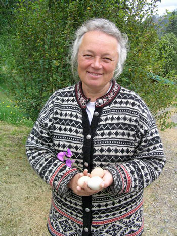 Eileen Kiera holds eggs from the resident chickens