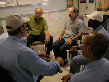 Fred Sly, director of the Oregon Prison Project, in green shirt, leading a Nonviolent Communication class at San Quentin State Prison.