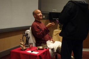Anam Thubten makes a clarifying dharma point (open hand)
