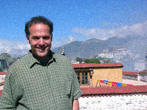 Jim Blumenthal on the Johkang temple in Lhasa, Tibet, with the Potala Palace in the background