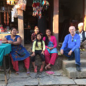 Bill Hason visiting with people from the village where he first served in the Peace Corps