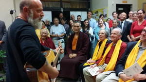 Jerry Joseph performs "Craters of the Moon," enjoyed by Geshe Tenzin Dorje, Yangsi Rinpoche, Susan and Jack Blumenthal, and a crowd from the Maitripa College community