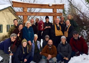 At the end of Rohatsu sesshin in 2015, warm smiles in the snow. The sangha surrounds Senseis Jintei Harold Little and Etsudo Patty Krahl.