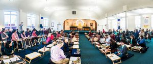 The Nalanda West shrine room filled with participants during a teaching session by Dzogchen Ponlop Rinpoche.
