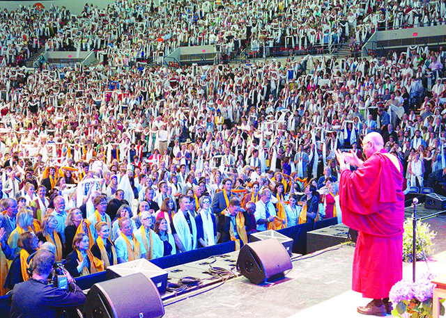 Audience of over 10,000 offers khatas to His Holiness the Dalai Lama, at the conclusion of the three-day environmental summit hosted by Maitripa College in 2013