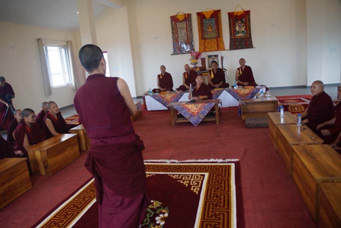 Nuns practice debating in preparation for the geshema exams.