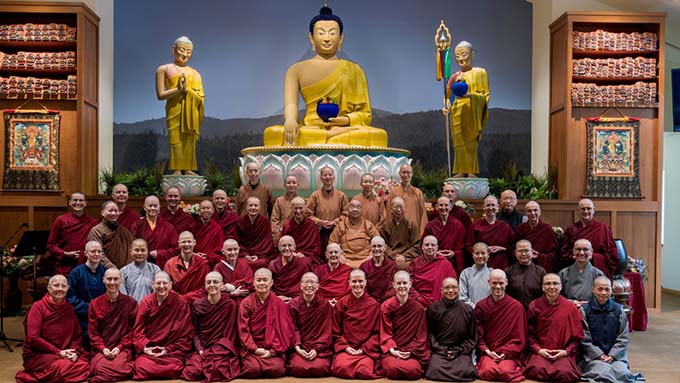A joyful groups of monastics study the Buddha Vinaya together in the new Buddha Hall.