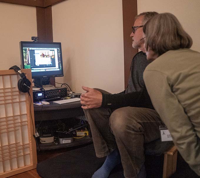 Various members of the sangha have volunteered to learn how to operate the new audiovisual system.