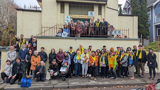 Attendees for the Path to Plenty Walk gather for a group photo at Portland Dhamma Center, location for the start of the walk.