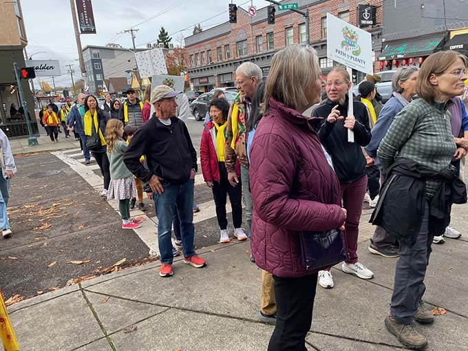 Attendees make their way along the walk path on Southeast Hawthorne.