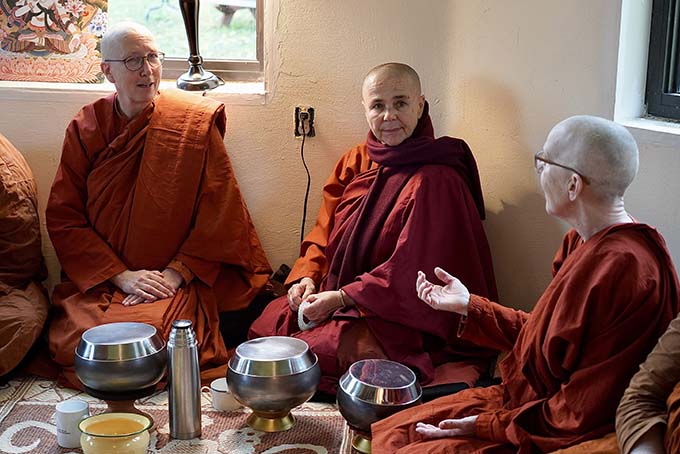 Ayya Anandabodhi, Ayya Santacitta, and Ayya Ahimsa, elders in the ordaining bhikkhuni sangha, confer before the ceremonies.