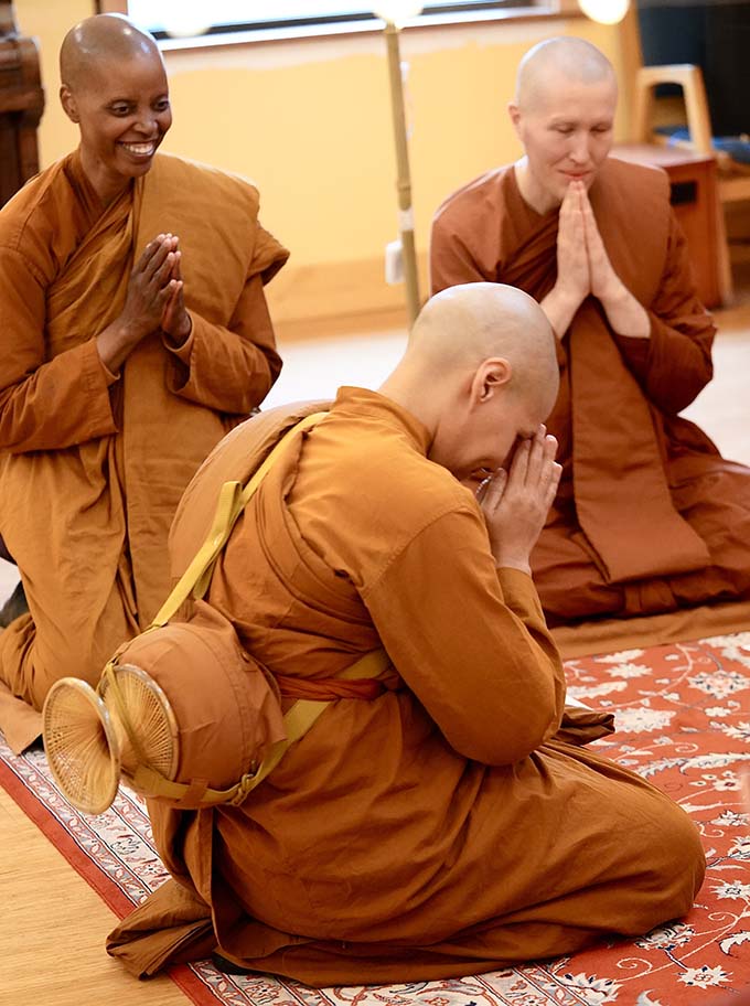 Venerable Satima of Parayana Vihara rejoices that another bhikkhuni is joining her community, as Venerable Kaccayana of Dhammadarini looks on.