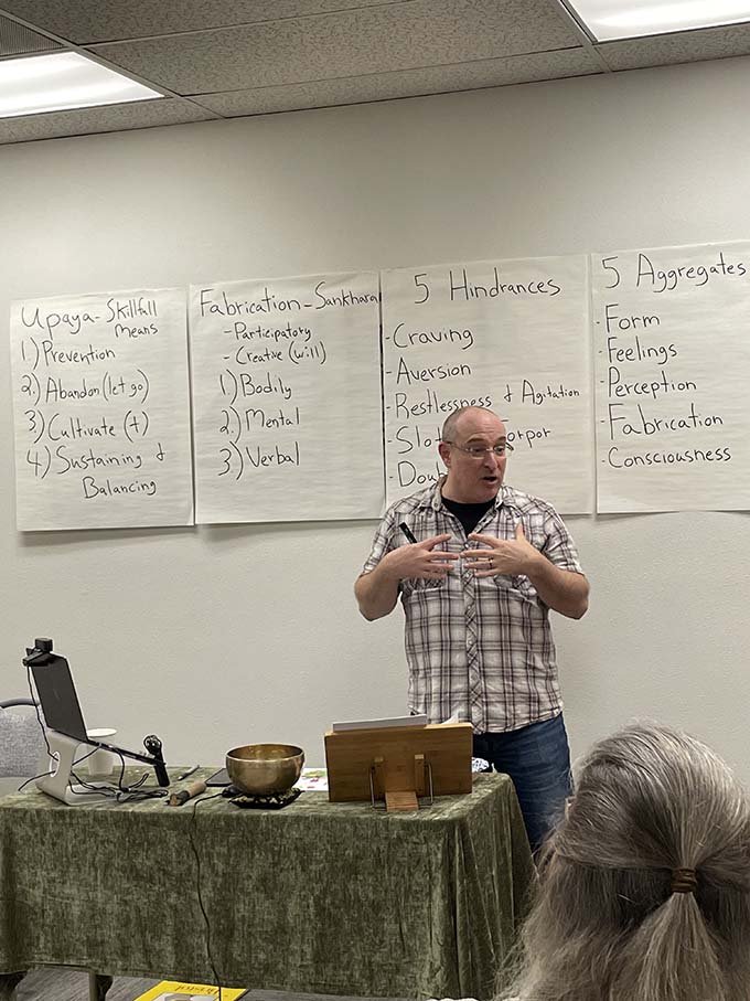 Maloof teaching the eightfold path class, a part of the expanded curriculum.