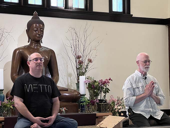 Maloof and Banks on the dais, in a moment of meditation.