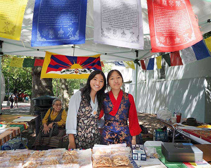 Students from the Tibetan Language and Culture School selling khapseys, Tibetan cookies, at TibetFest at Seattle Center in August, 2025.