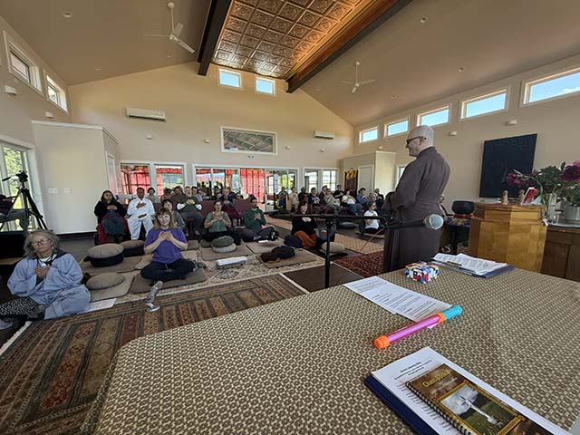 People on retreat in the new temple are uplifted by their mountain view