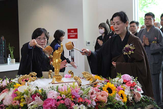 Participants bathed the Buddha with fragrant water, symbolizing inner purification and spiritual renewal