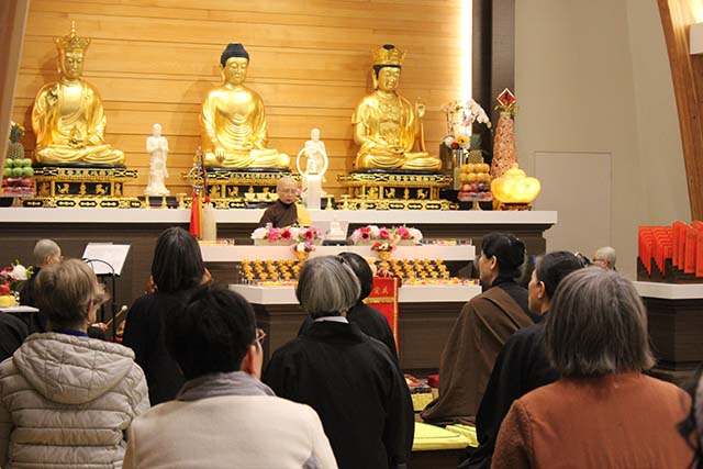 During the ceremony, the abbess led the congregation in reverent sutra chanting