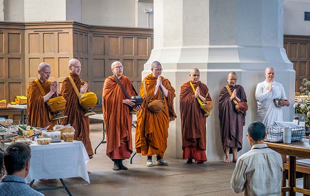 Alms at St. Mark’s visiting bhikkhunis in May, 2026. From left: Ajahn Nisabho, Ajahn Kovilo, Ayya Ānandabodhī, Ayya Niyyānika, Ven. Sīlānandā, Ven. Nadī, Anāgārikā Khemā