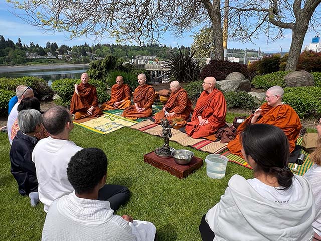Monastics and lay people gather in Olympia’s Plaza Park for a celebration of Vesak, Buddhism’s most important holiday