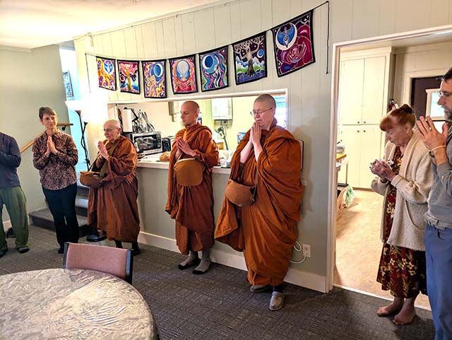 Suvijjānā Bhikkhunī, Tejassi Bhikkhu, and Niyyānika Bhikkhunī offer a blessing, after receiving a meal at Portland Insight Meditation Center