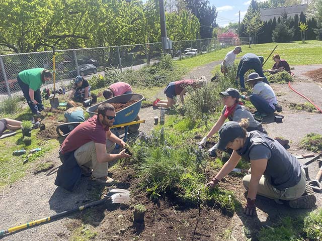 Sangha members join Portland nonprofit Depave’s Earth Day planting event, at a local school that converted pavement to green space