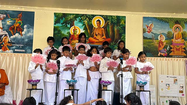 Dhamma School children perform devotional songs for Vesak, commemorating the birth, enlightenment, and passing away of Buddha. The school reflects Ven. Pagnananda's commitment to educating the next generation