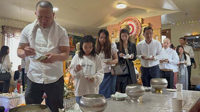 Cambodian Buddhist community members offering dana and food to Ven. Pagnananda, and the monks at the Tukwila temple