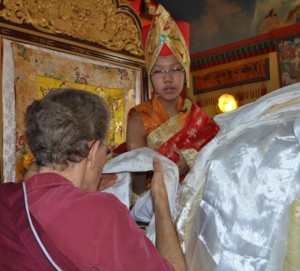 Asanga Rinpoche being offered a Tibetan offering scarf called a katag