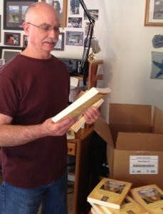 Paul Gerhards inspecting books for quality as they arrive