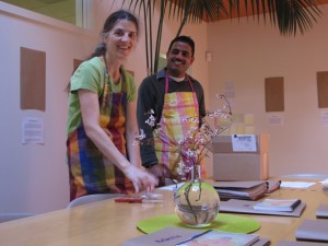 Kerrin O'Brien, marketing, and Anand Kulkarni, sales, pack books for shipment.