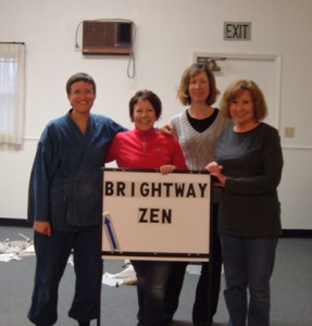 Sangha members Domyo Burk, Amy Plavak, Dawn Holt and Ellen Carlin, creating a sign to help people find the zendo