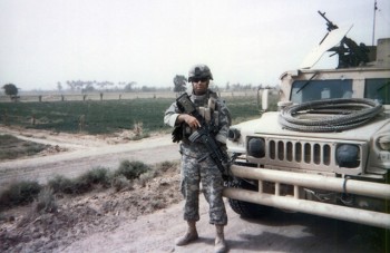 Paul Kendel with his Humvee in Iraq