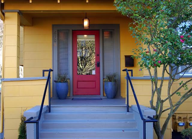 The front entrance of bright yellow Seattle Mindfulness Center is welcoming