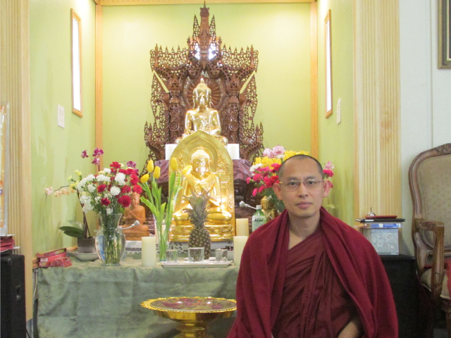 Ven. Pannobhasa sitting before the altar in the Dhamma Gone Yee Snohomish monastery