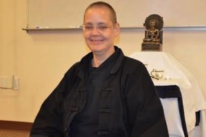 Ann Tjhung, a lay Buddhist practitioner, leads the Buddhist practice at JBLM