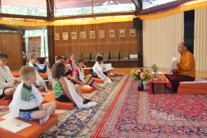 Saraha founding teacher Lama Sonam Tsering leads the first Saraha School class on Sept. 4, introducing “Lotus Light, Vol. 1,” a book designed for children to learn Tibetan language and dharma concepts