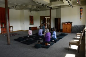 A drop-in sit, in the center’s spacious main hall