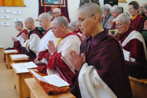 Three-year retreatants practicing the Green Tara Puja in the meditation hall