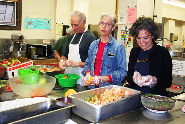 Nalandabodhi Seattle members (L to R) Don Ross, Susan Kirchoff and Damayonti Sengupta help prepare Friday Feast