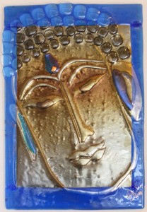 A compassionate Buddha, created by Jill Whitmore of kiln-formed glass, sometimes in six layers
