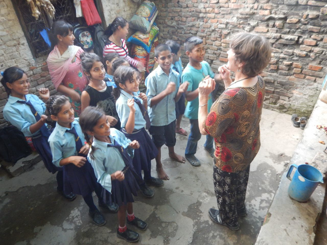 Susan Alotrico leading Nepali children in uplifting activity