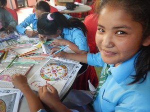 Student colors a mandala of strength at healing arts camp