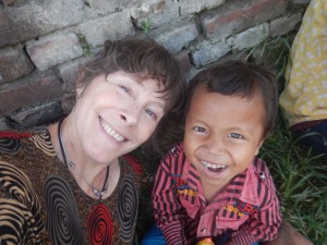 Susan Alotrico with Rawi, a young boy recovering from the earthquake