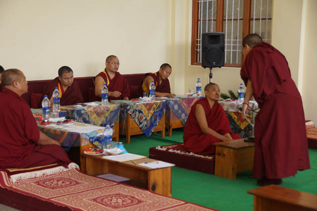 Nuns debating in front of the geshema examiners. The geshema examination process is an extremely rigorous one that takes four years in total, with one round per year each May.