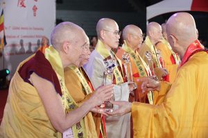Venerable Thubten Chodron receives the Global Bhikkhuni Award from the 90-year old chairman of the Chinese Buddhist Association, Venerable Jen Shin.