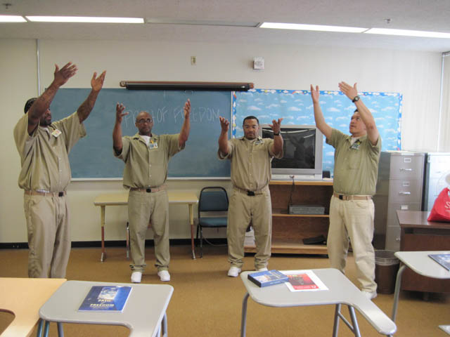 Nate, second from right, leads a mindful movement exercise, a component of every class.