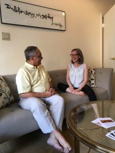 Paul Belserene and Maria Stella share a moment in the community room.